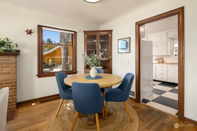 Dining area of the living room, kitchen beyond.