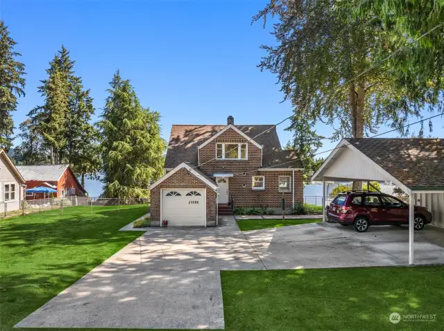 Front door, single car garage and two car carport.