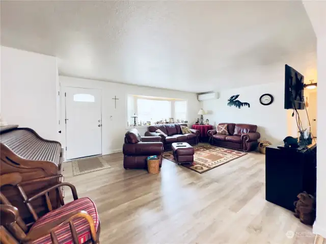 231 Maple Ave NW, Napavine WA view from garage entry towards living room with the beautiful bay window.