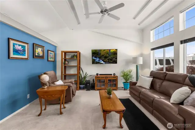 Living room, lots of natural light, tall ceiling with character
