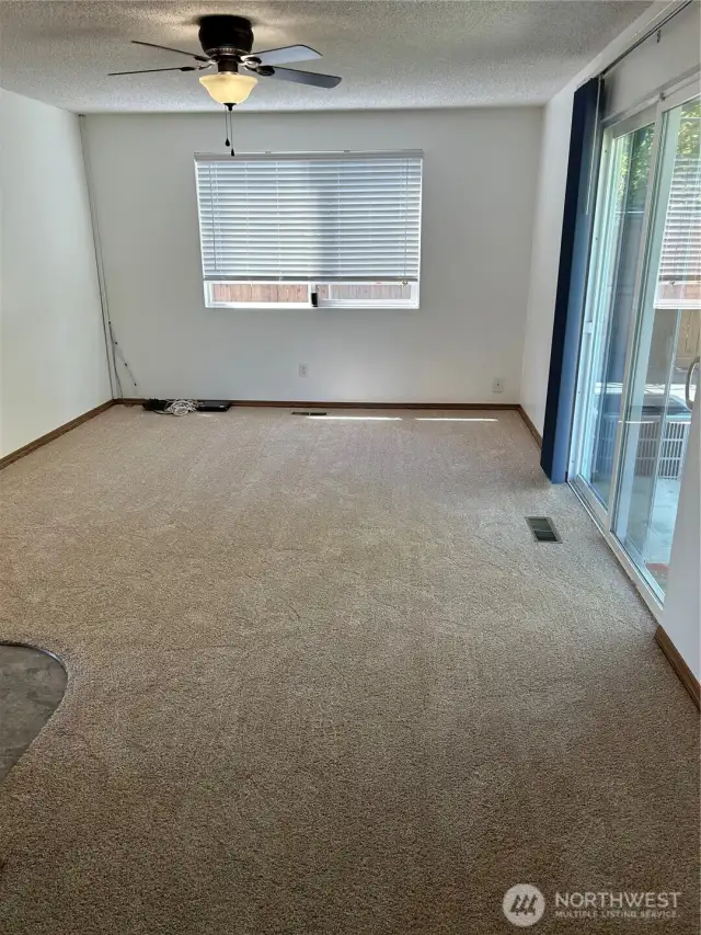 Spacious Family Room Off Kitchen Features Slider That Opens Up Into The Back Yard.