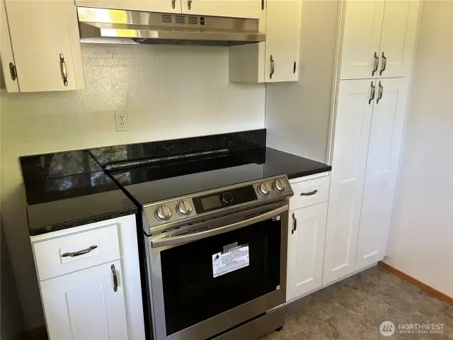 Brand New Range, Hood & Cabinets! Seller had old stovetop and small wall oven taken out and added more cupboard space, New Stove/Range & Hood! Also Brand New Dishwasher & Newer refrigerator!