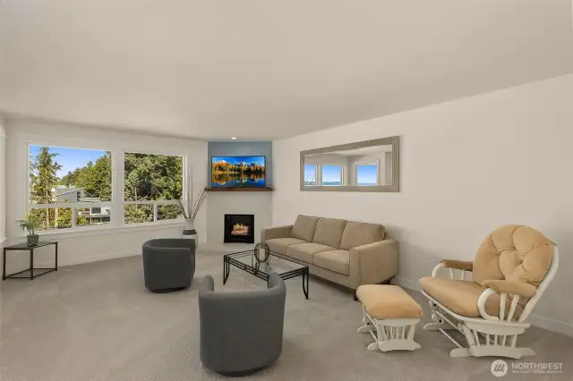 Huge living room with new carpet, window and baseboard trim. Gas fireplace has a remote control and gas expense is incl. in HOA dues.