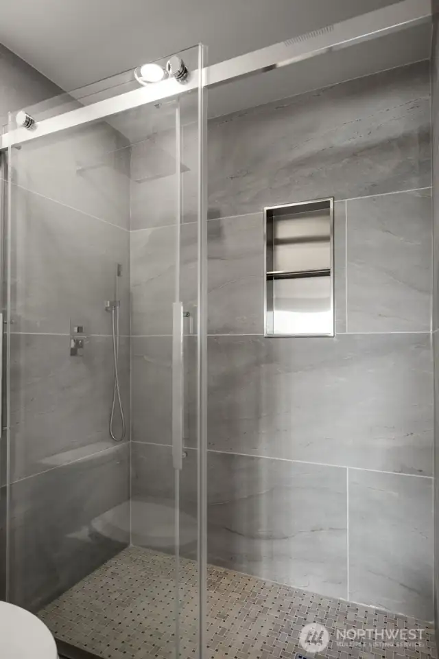 Primary bath....Beautifully tiled shower with spray handle