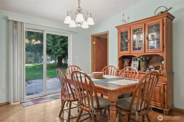 Dining area with slider to patio and door to laundry