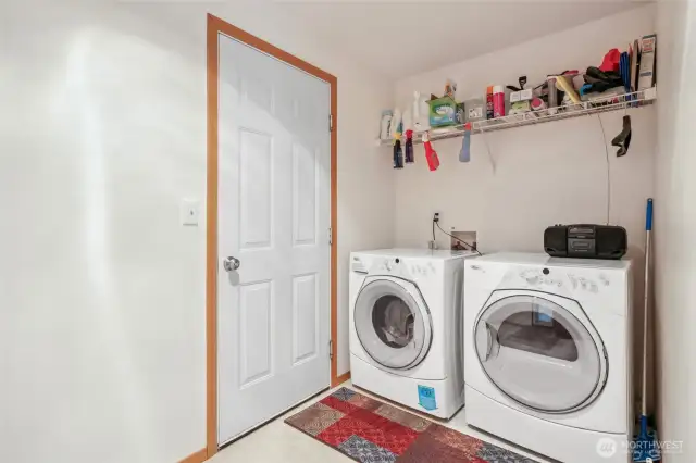 Utility room conveniently located off garage.