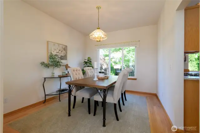 The elegant dining room is seamlessly connected to the main living spaces, and adjacent to the kitchen--ideal for entertaining.