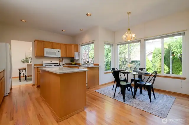 Spacious and open-the kitchen hosts this lovely eating space that enjoys beautiful garden views out to the back patio and koi pond.