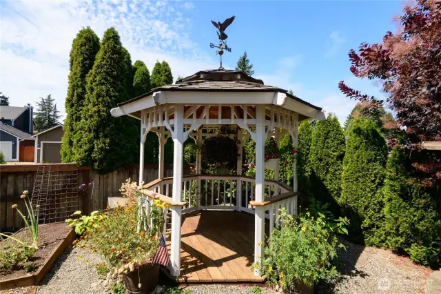 Our favorite back-yard space; nestled in the heart of this meticulously curated garden this gazebo offers the best seats in the house for enjoying all the beauty nature has to offer.