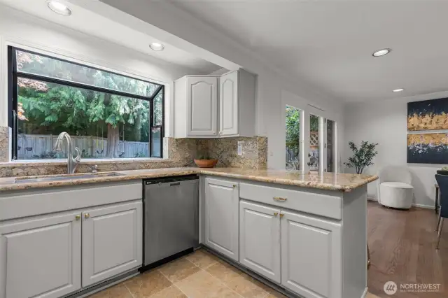 Granite counter tops and backsplash help complete the kitchen.