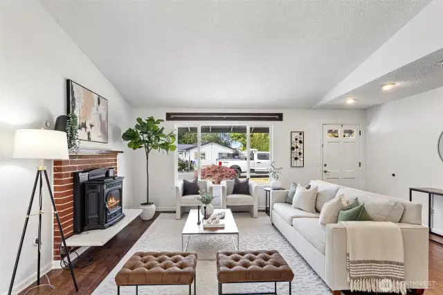 Nice, engineered wood floors and wood fireplace.