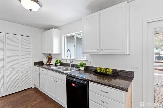 Spacious kitchen with new stove and microwave.