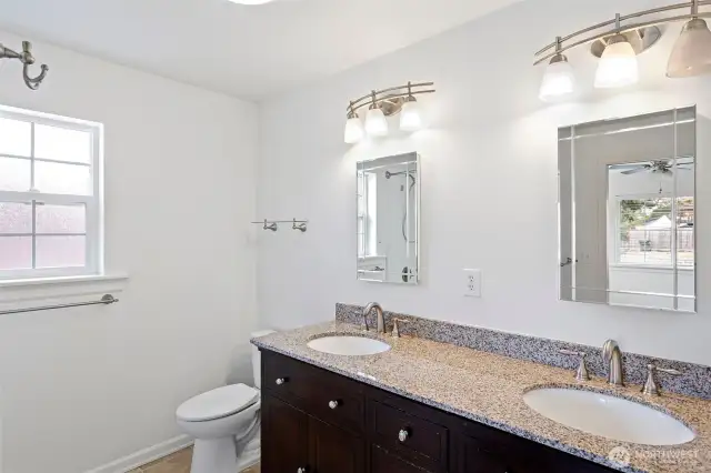 Primary private bath with walk in close attached, double since and large tub.