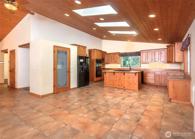 Open island kitchen with a pantry.
