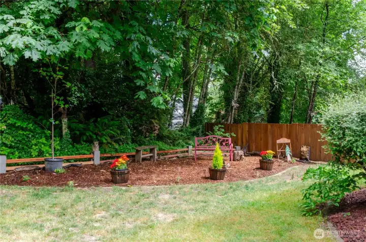 This level, sunny area backs up to a natural area, which is also part of the property.