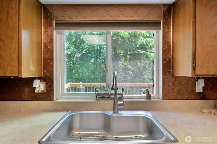 Enjoying the natural beauty of the backyard helps make dish-washing a pleasant experience!