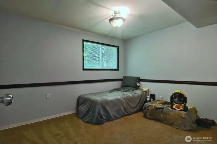Also on the lower level is an extra room currently used as a bedroom.
