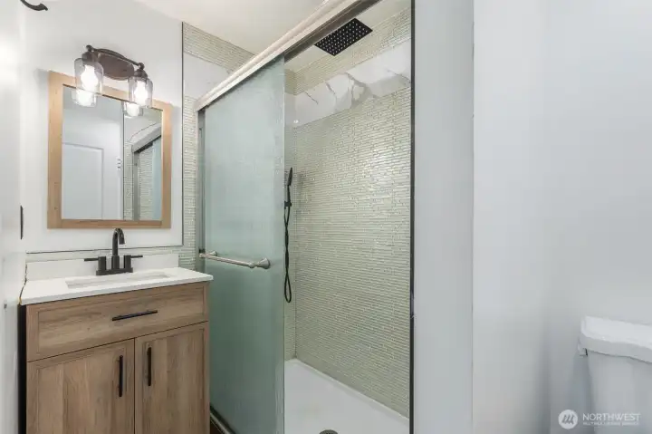 Main floor bathroom with shower - remodeled approx 2022