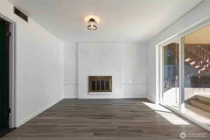Lower level - ideal for multi generational living or create a M-I-L style suite. This room opens to covered patio and level, fenced back garden
