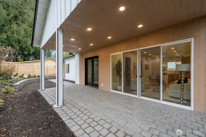Wow - what a covered patio!!  With access from the sliders and French doors!