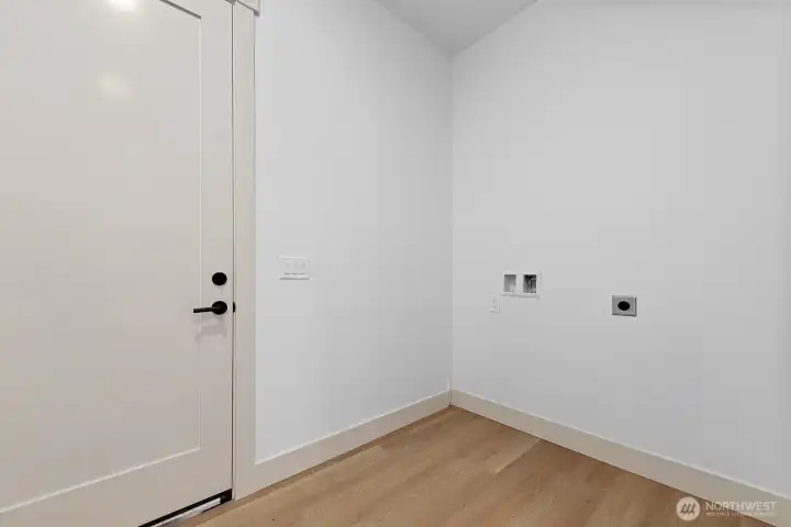 Dedicated laundry area near garage.