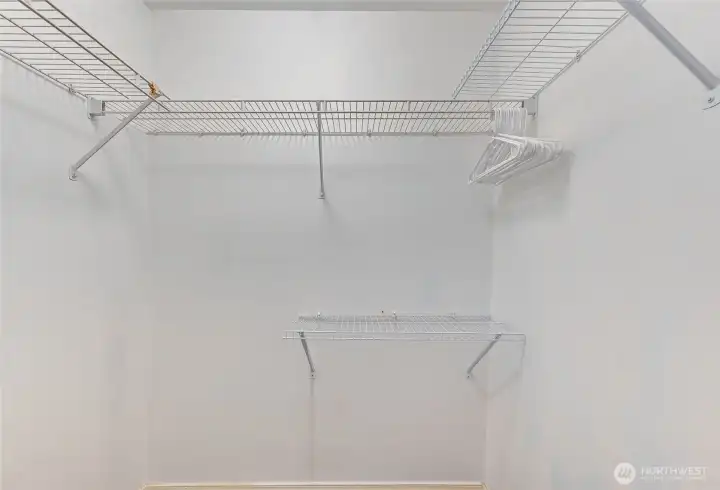 Walk-in closet in primary bedroom