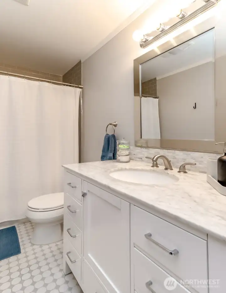 Marble vanity with ceramic tile floor