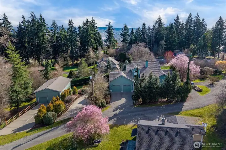 Beautiful shy-acre property with spectacular home and shop.