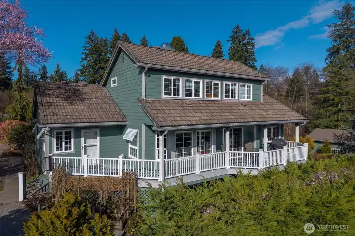 Wraparound deck with access from the living room and primary suite.