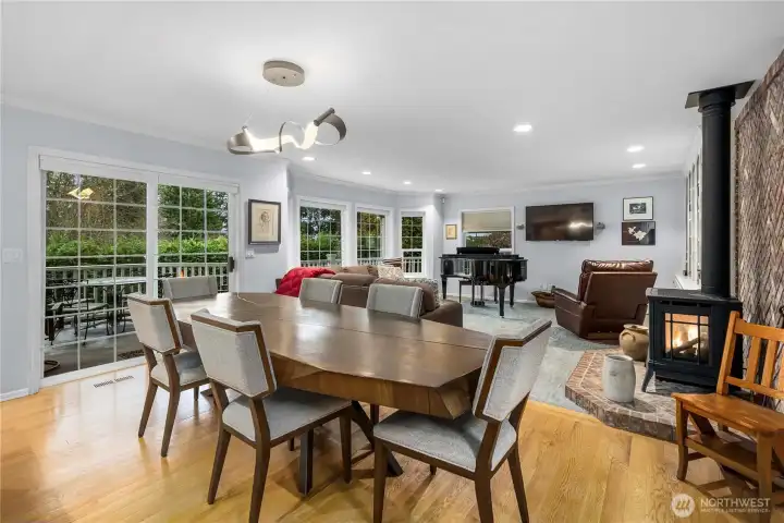 Elegant hardwood floors grace the entry and open concept kitchen and dining room.