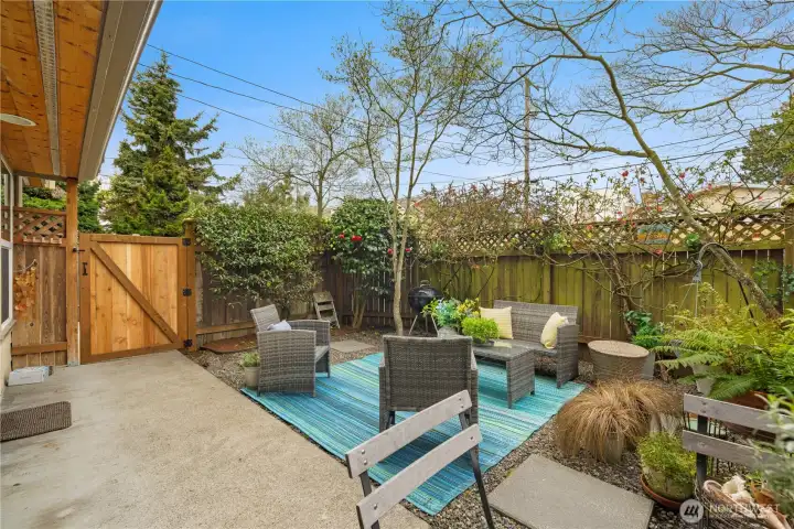 Private fenced yard in the front with gate access to the main entry.