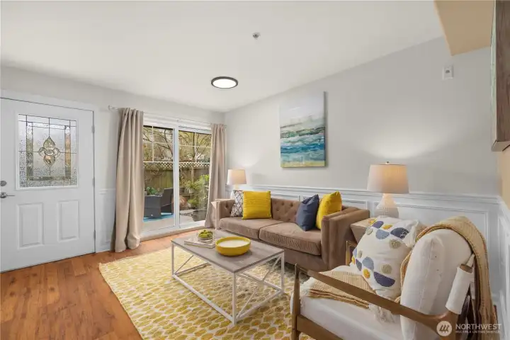 Main living area is bright and opens up the private outdoor yard.