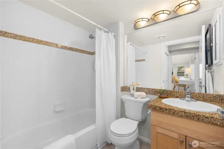 Full bathroom has new flooring.