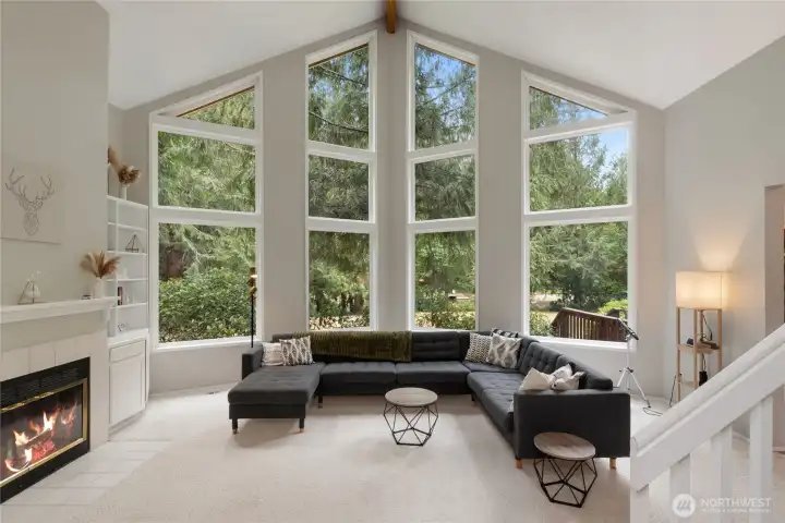 Spacious living room with stellar views of the expansive back yard and lake.