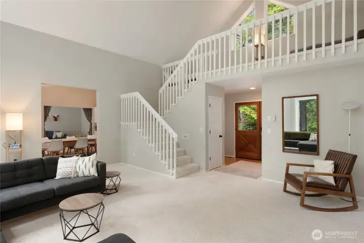 Loft overlooking the Living Room space with dining room view.