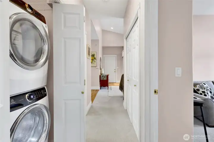 Conveniently located between the bedrooms, the closet houses a stackable washer and dryer. Its generous depth also provides valuable additional storage space.