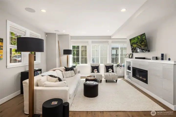 Large windows fill the home with natural light, complemented by top-down bottom-up shades that offer privacy, light control, and a touch of elegance.