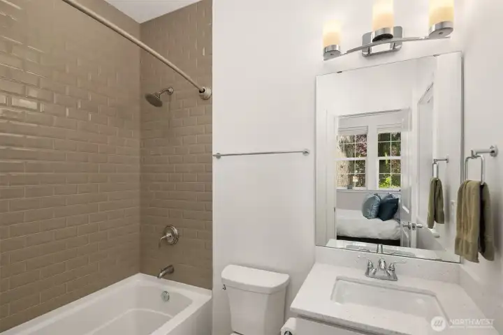 A full en-suite bath complements the bedroom, delivering both comfort and privacy.