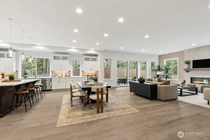 Step into the stunning great room with peaceful wooded outlooks from every window.