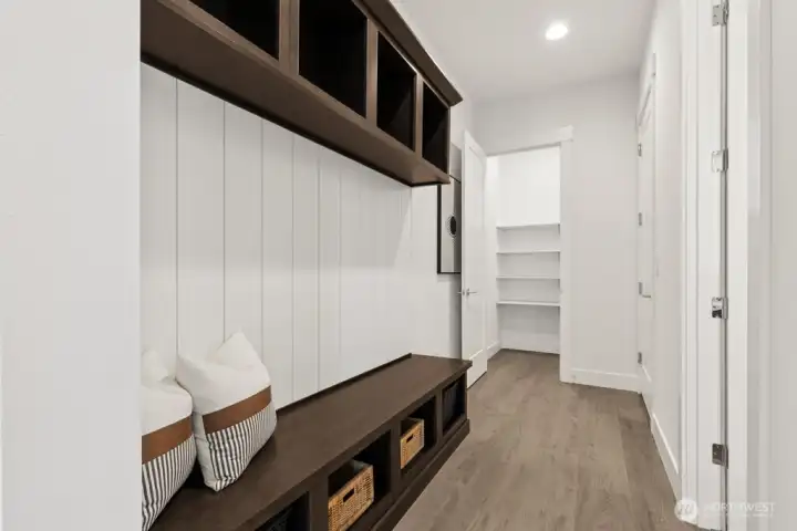 Garage entry, extra storage and powder room. This is a great space to drop coats and shoes.