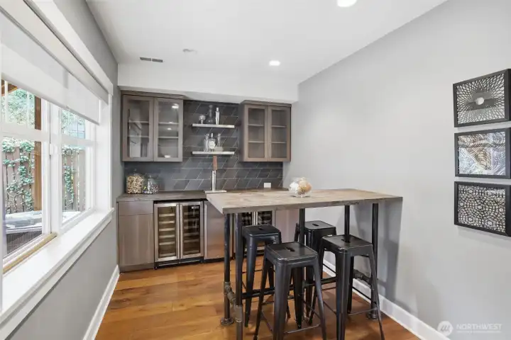 Bar with wine shelves and keg fridge.