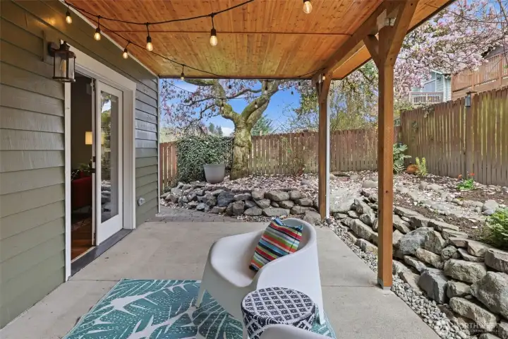 This patio is covered by the deck above and dry year round.