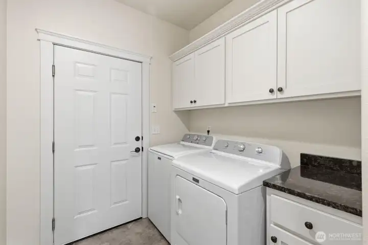 Laundry room off kitchen leading to Garage
