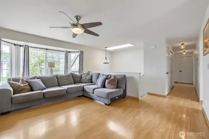Bay window bump-out brings in beautiful natural light. Engineered hardwood flooring adds warmth and durability.