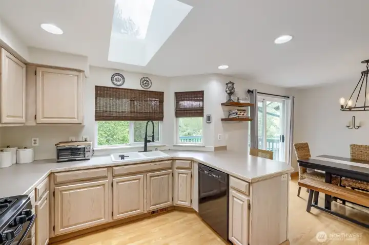 Peninsula island with eating bar creates casual seating space.