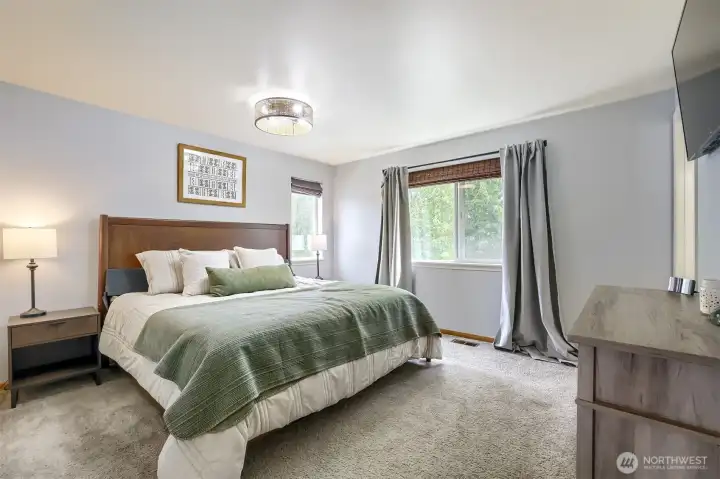 Spacious primary suite offers a peaceful retreat.