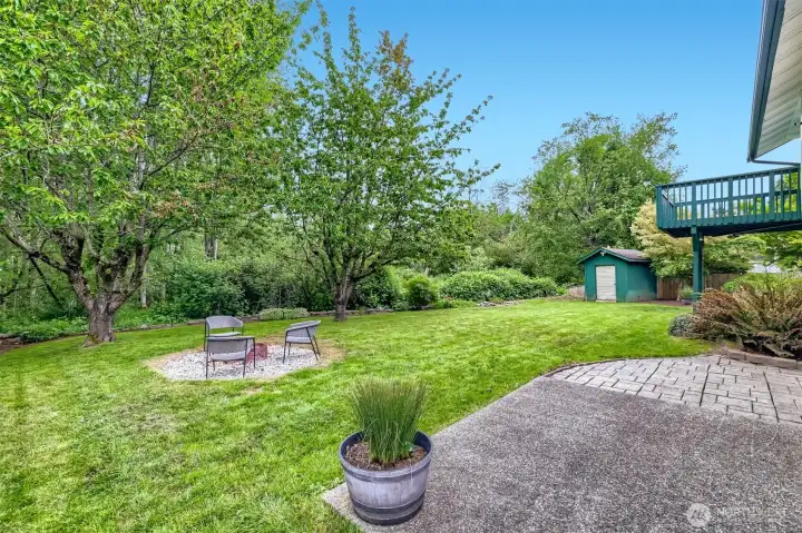 Relax outdoors surrounded by mature trees and peaceful scenery.