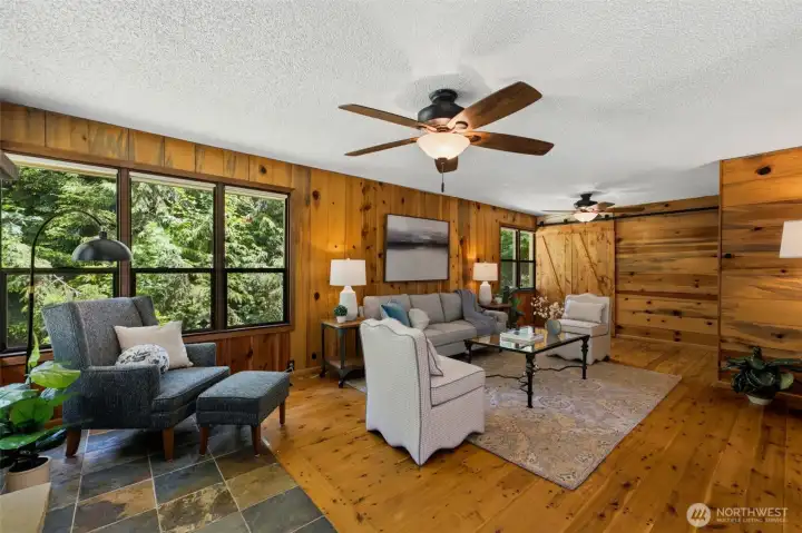 Beautiful wood accents and barn-door details elevate the home's authentic farmhouse style.