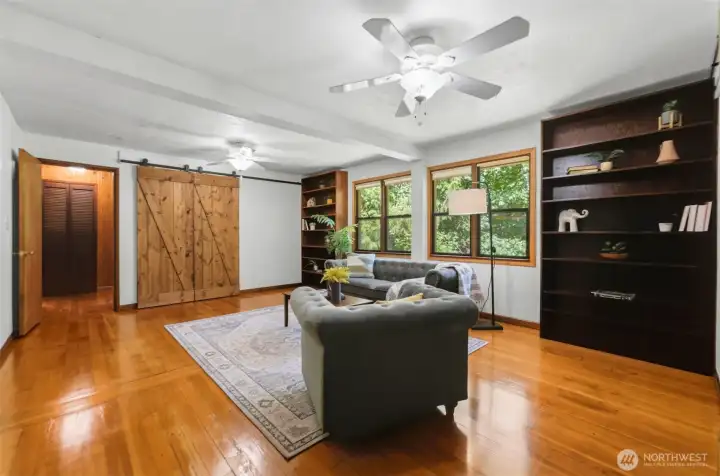The family room gives you endless options for entertainment, hosting, or some quiet time. There are two large closets featuring barn doors for storage.