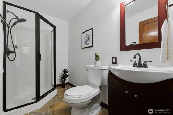 This 3/4 bath next to the guest bedroom makes this an ideal second primary or guest suite bathroom.